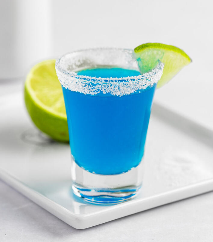 Calypso Blue Kamikaze - A shot made with Blue Curacao, Grey Goose, and lime juice chilled with a sweet outer rim. Named for our delightful friend and lifetime VIP, Calypso Drake!