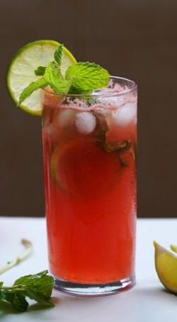 Martian Mojito - We take fresh watermelon chunks and mint muddled in simple syrup and lime juice, add light rum, and a splash of soda water with fresh mint and a lime wheel garnish.